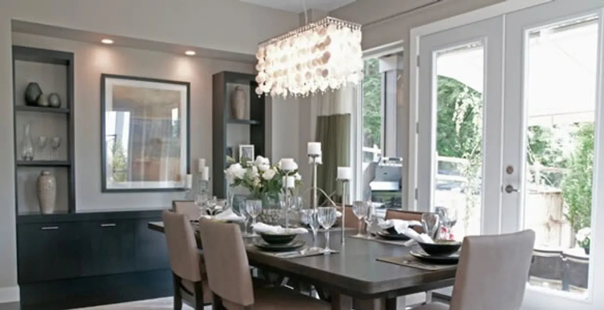 Elegant dining room chandelier installation above table in Spokane, WA