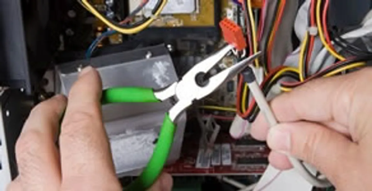 Licensed electrical contractor performing electrical repair with tools in Fairchild Air Force Base, WA