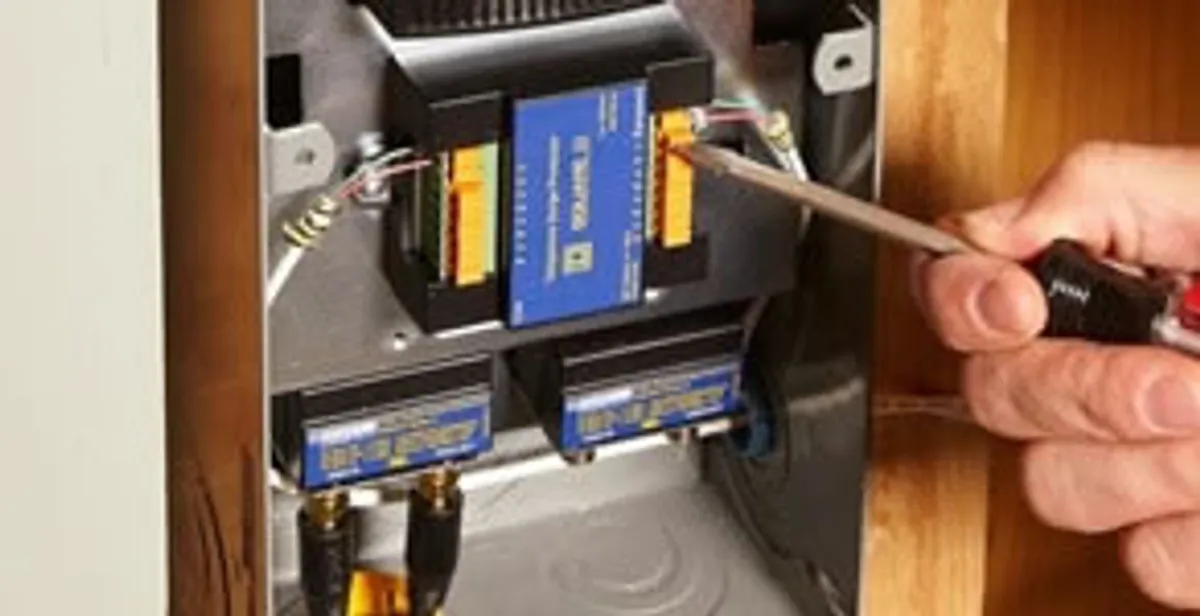 Whole home surge protection device being installed by a licensed electrician to protect electrical systems in Spokane, WA